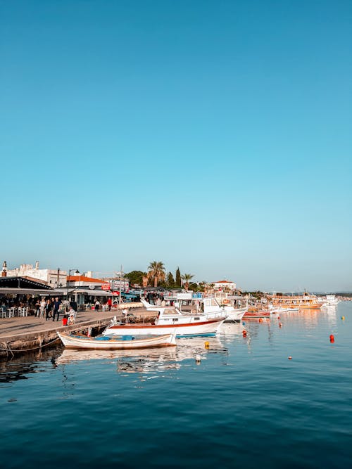 Scenic view of a seaside promenade along a beach in the Ria Formosa area, showing the shoreline and pathway.